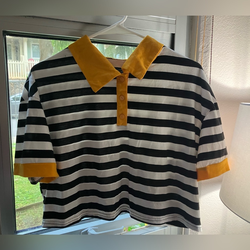 Striped Black and White Polo Shirt with Yellow Accents
